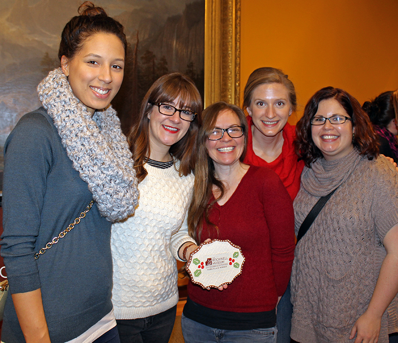 The Third Place Team poses with their winning plaque