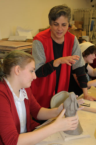 Director of Education at The Rockwell Museum, Gigi Alvare, works directly with the students 